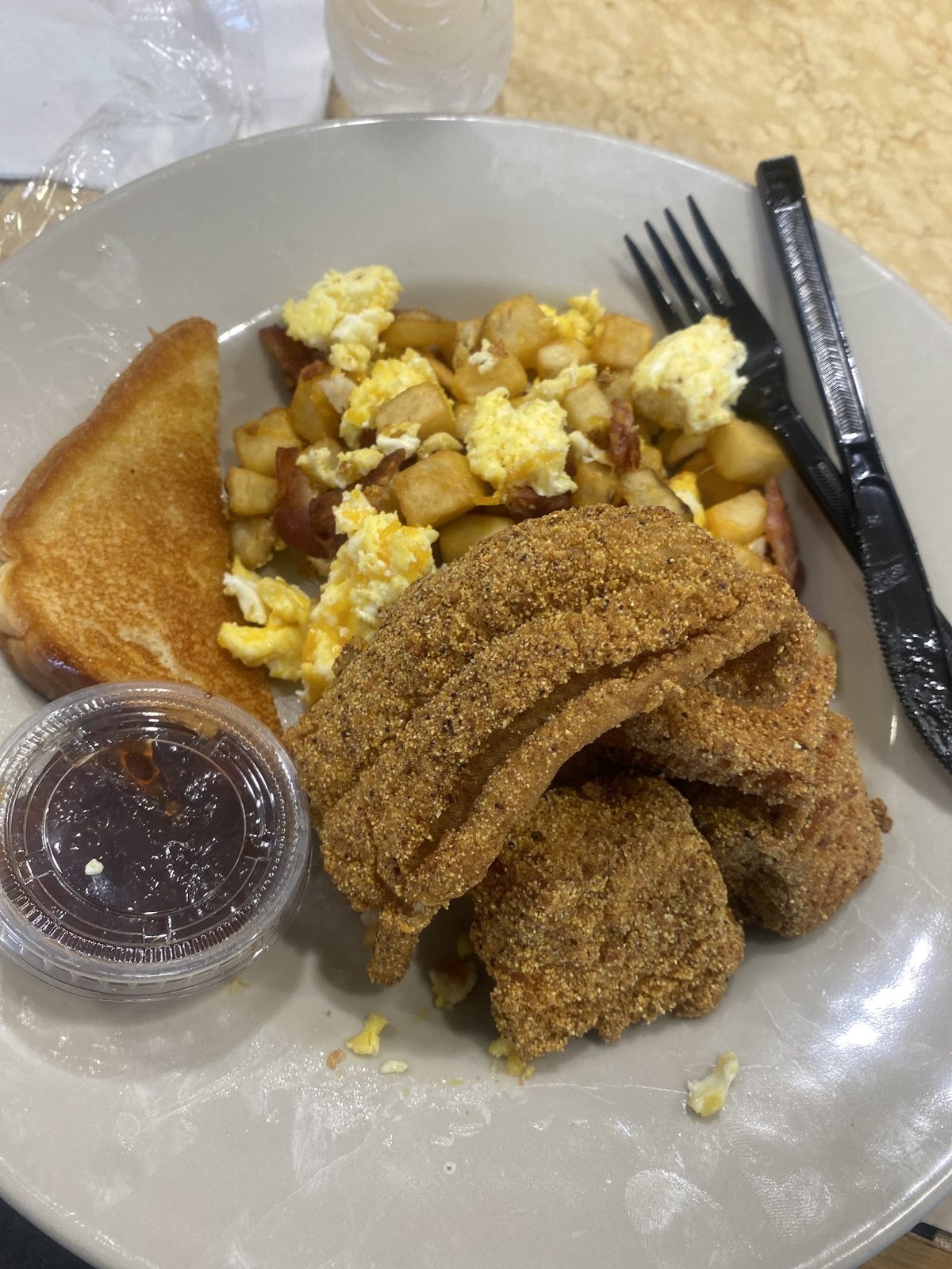 Fish with grits and eggs